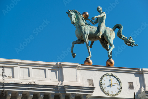 Granada City Hall horse sculpture on the top of the facade over blue sky