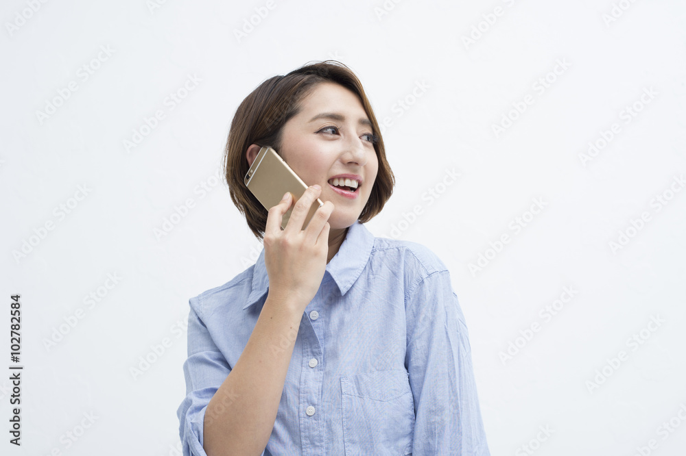 Women are having a conversation on a mobile phone happily Women are having a conversation on a mobile phone happily