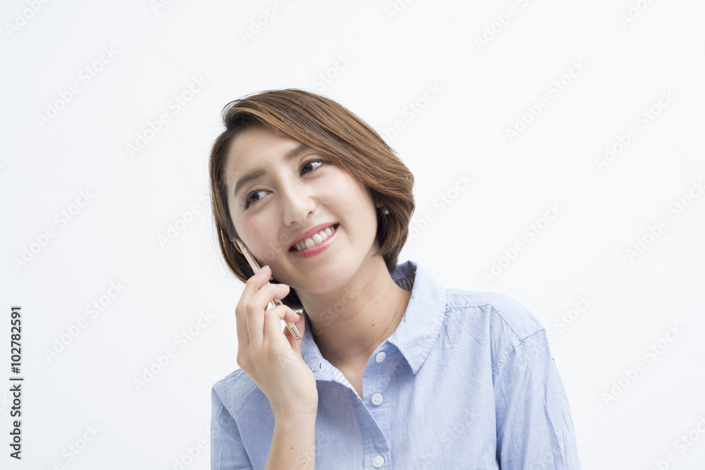 Women are having a conversation on a mobile phone happily Women are having a conversation on a mobile phone happily