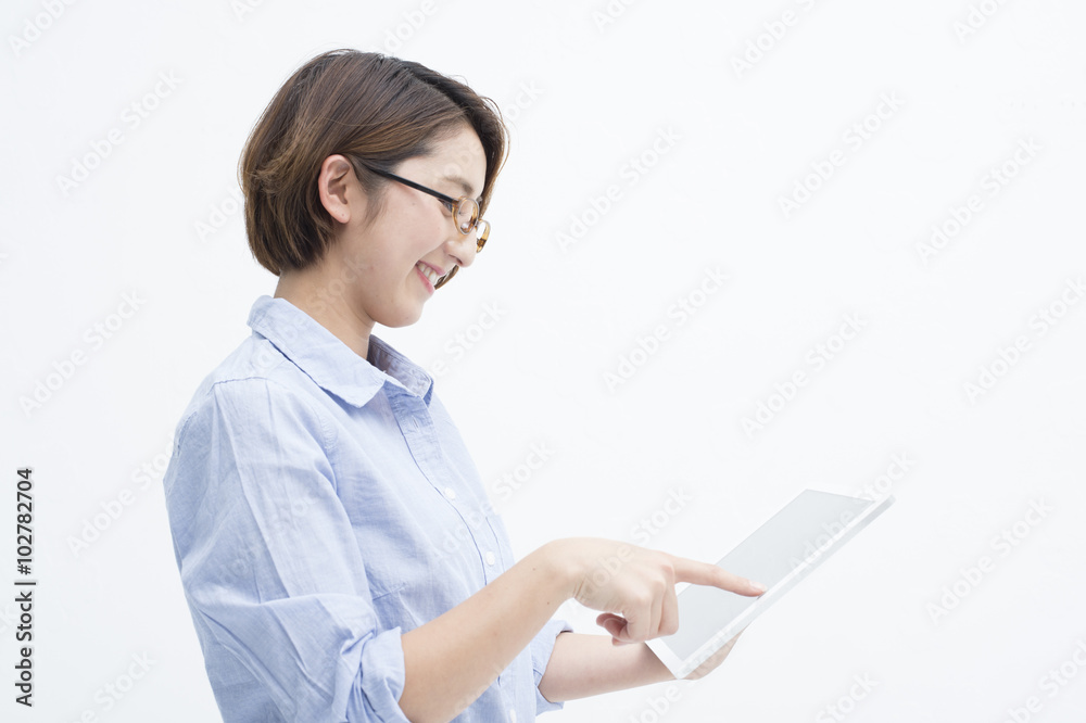 Women are using the electronic tablet happily Women are using the electronic tablet happily