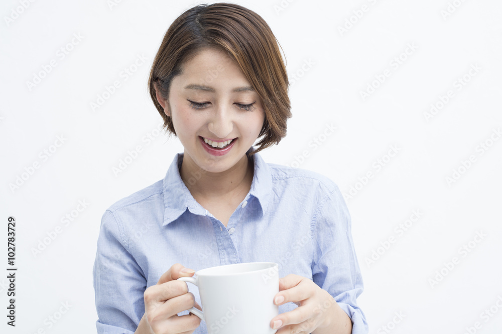 Woman smiling with a white mug Woman smiling with a white mug