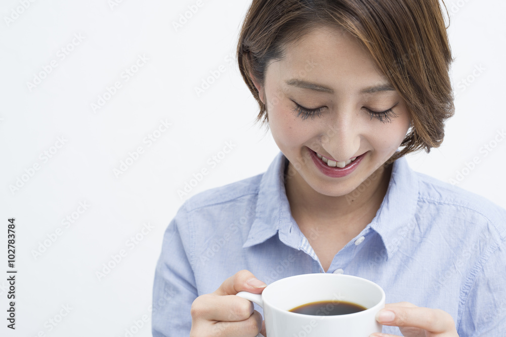 Woman smiling with a white mug Woman smiling with a white mug