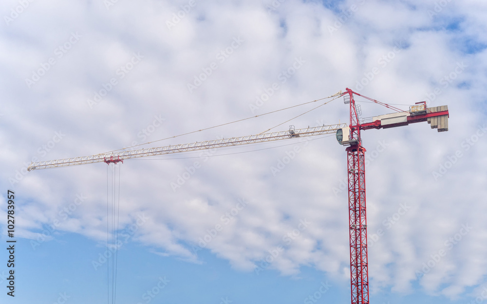 Tower crane on cloudy sky background
Tower crane on cloudy sky background