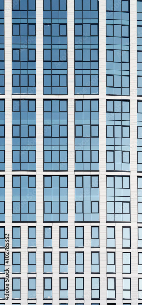 Modern High Rise Glass Building and Blue Sky