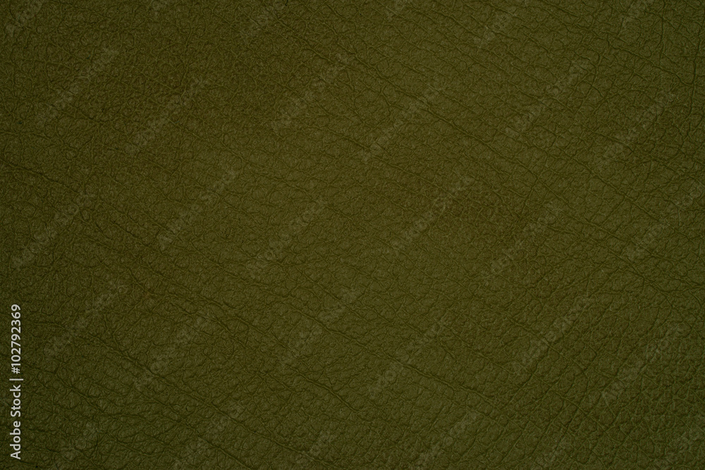 Fototapeta premium Green leather texture closeup, useful as background