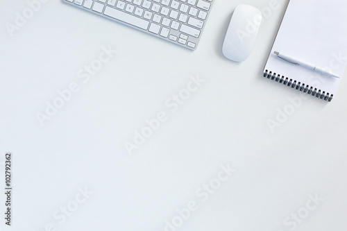 Business Background on white Table with Keyboard Mouse Notepad