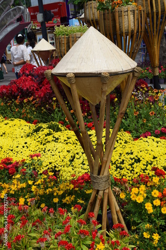 flower festival for Lunar new year decoration in Vietnam with many kind of colorful flowers and non la conical leaf hat