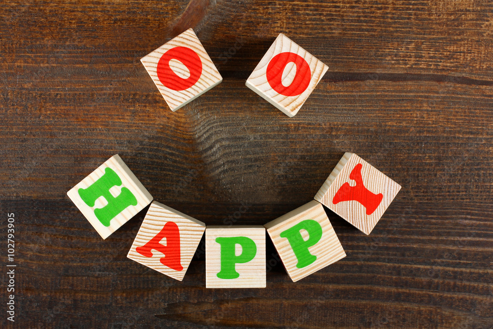 the word from children's wooden blocks with colorful letters on wooden table the word from children's wooden blocks with colorful letters on wooden table