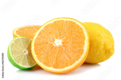 delicious and healthy, whole and cut into pieces the citrus fruit isolated on white background lie in a heap