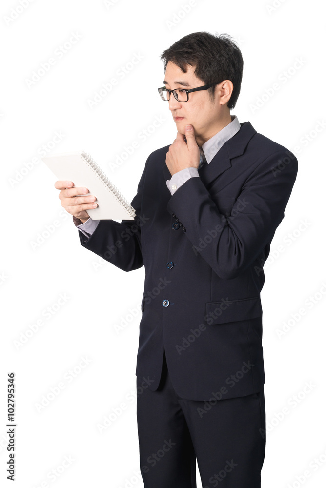 Asian businessman reading notebook or diary for checking, isolat Asian businessman reading notebook or diary for checking, isolat
