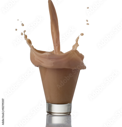 Milk chocolate splash isolated over white background