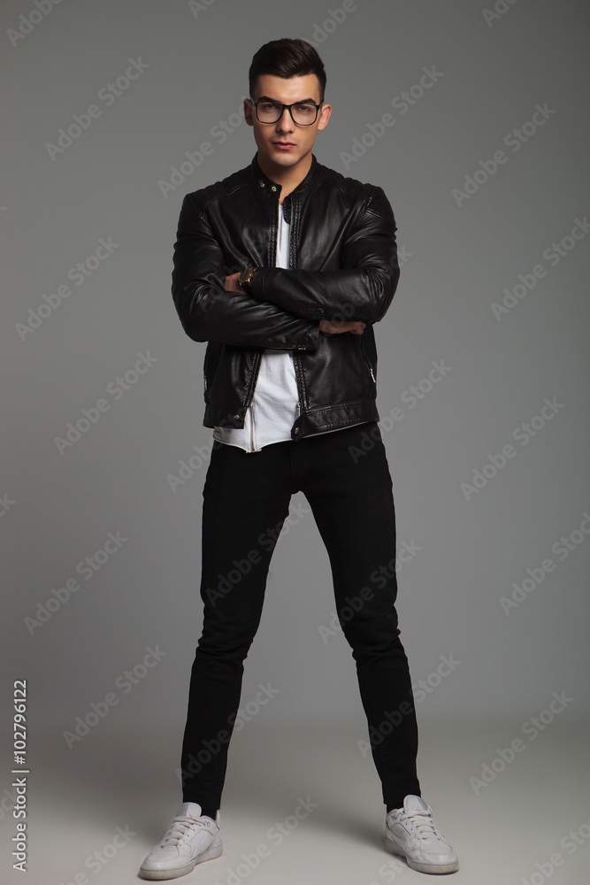 man in leather jacket wearing glasses pose in studio man in leather jacket wearing glasses pose in studio