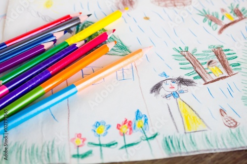 Child's drawing and colored pencils