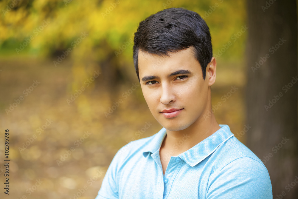 Portrait of Arabic nice man on the background of autumn park Portrait of Arabic nice man on the background of autumn park