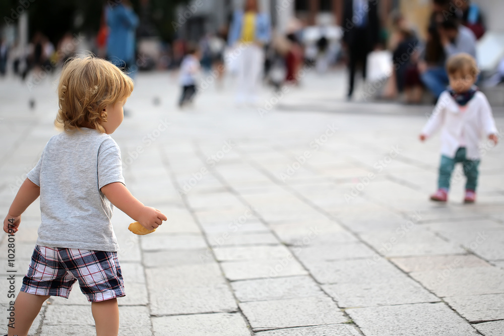 Fototapeta premium Baby boy playing with girl