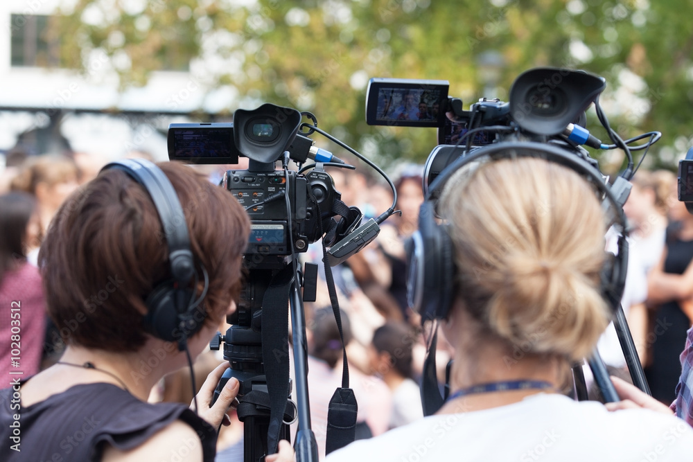 News conference. Filming an event with a video camera. News conference. Filming an event with a video camera.