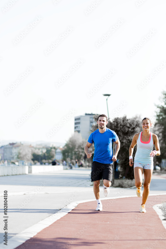 Fototapeta premium A man and a woman jogging