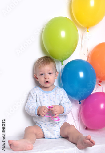 baby with balloons