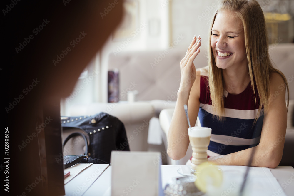Beautiful women smiling in restaurant Beautiful women smiling in restaurant