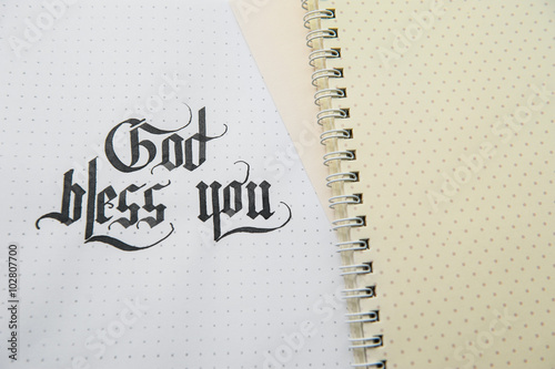 Text god bless you on the paper note texture