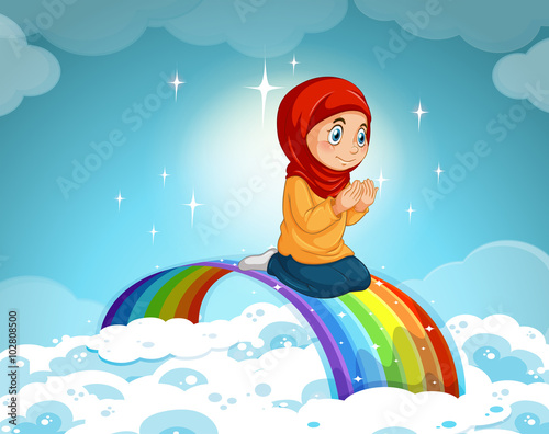 Muslim girl praying over the rainbow