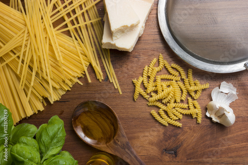 italian food mediterranean cooking pasta still life different kinds of pasta cheese and olive oil photo