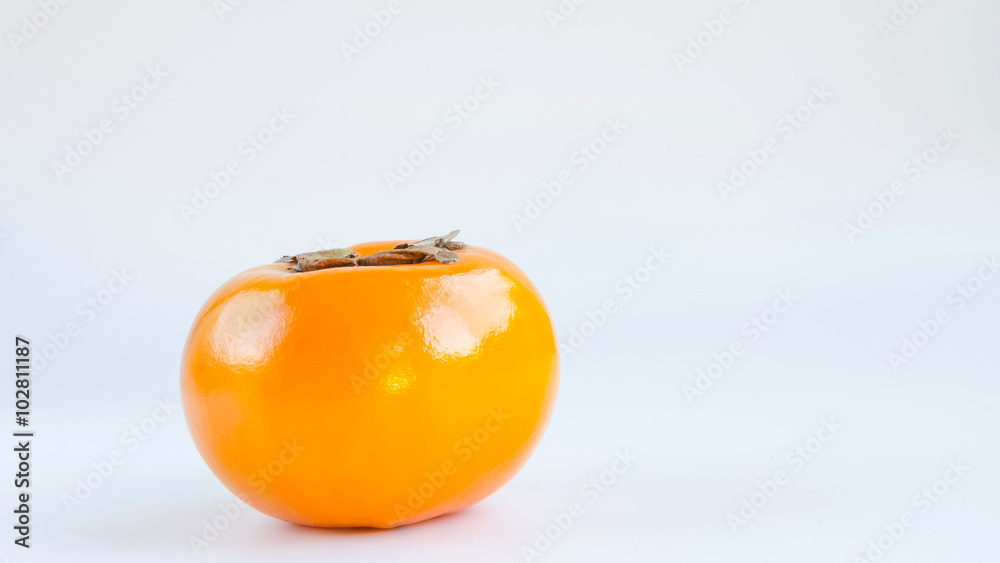 Delicious orange persimmons on white background