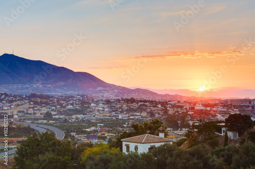 Quadro su tela Sunset Over Mountains and town Mijas, Spain