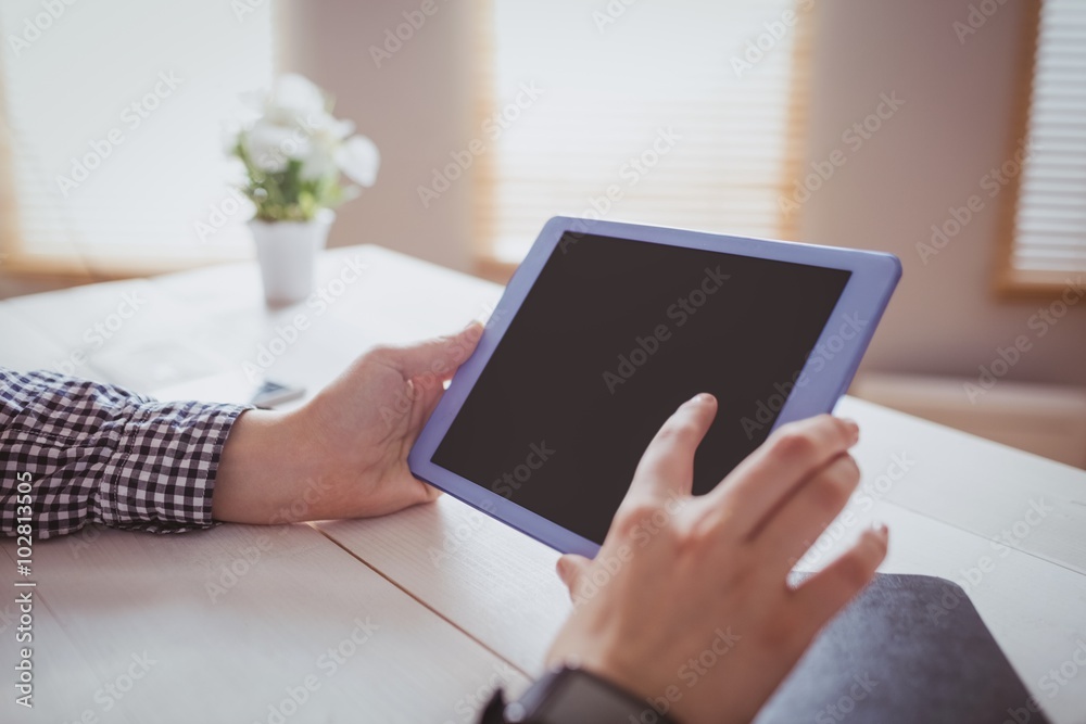 Businesswoman using her tablet