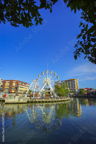 Malacca ferries wheel on malaca river side during sunny day