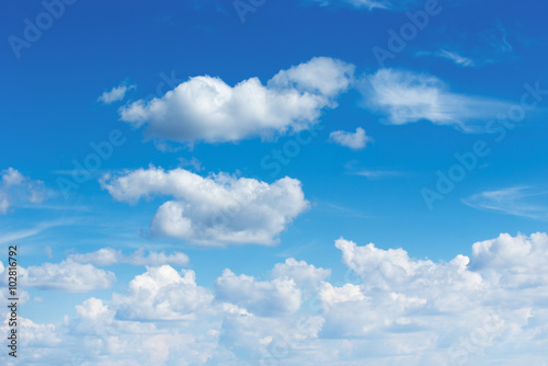 white fluffy clouds in the blue sky