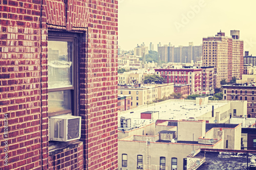 Vintage toned window with air conditioner, Harlem, USA