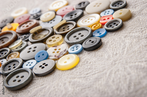 Buttons set on the white fabric horizontal