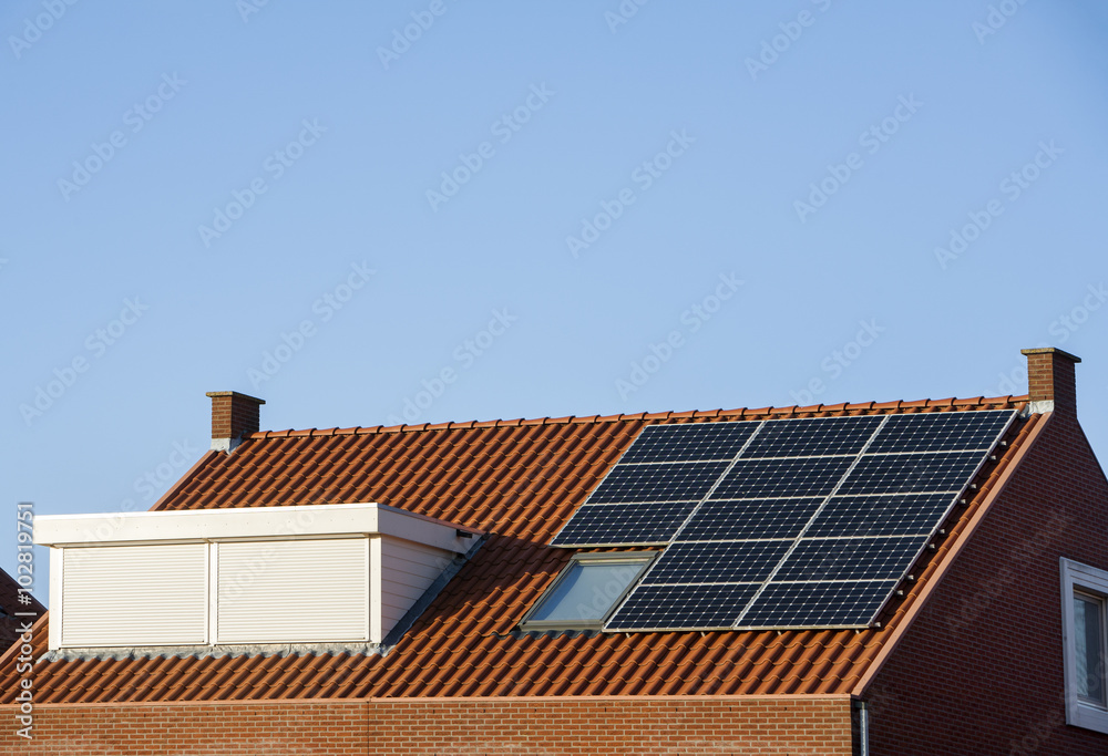 Roof with solar panels and skylight with rolling shutter Roof with solar panels and skylight with rolling shutter