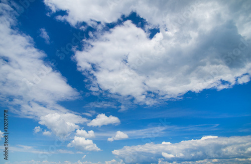 white fluffy clouds in the blue sky