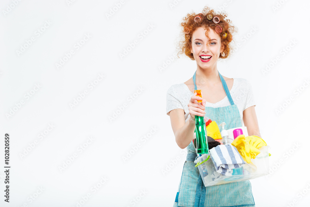 Housewife cleans with detergent spray Housewife cleans with detergent spray
