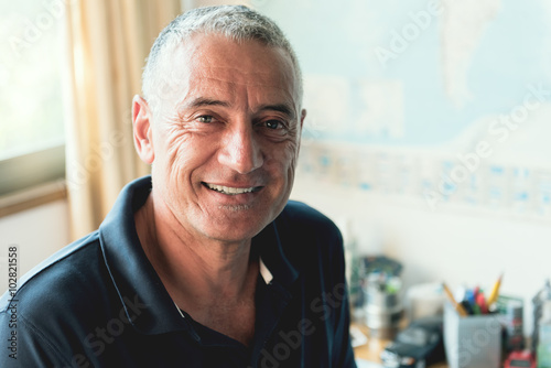 Mature Hispanic Man At Home office