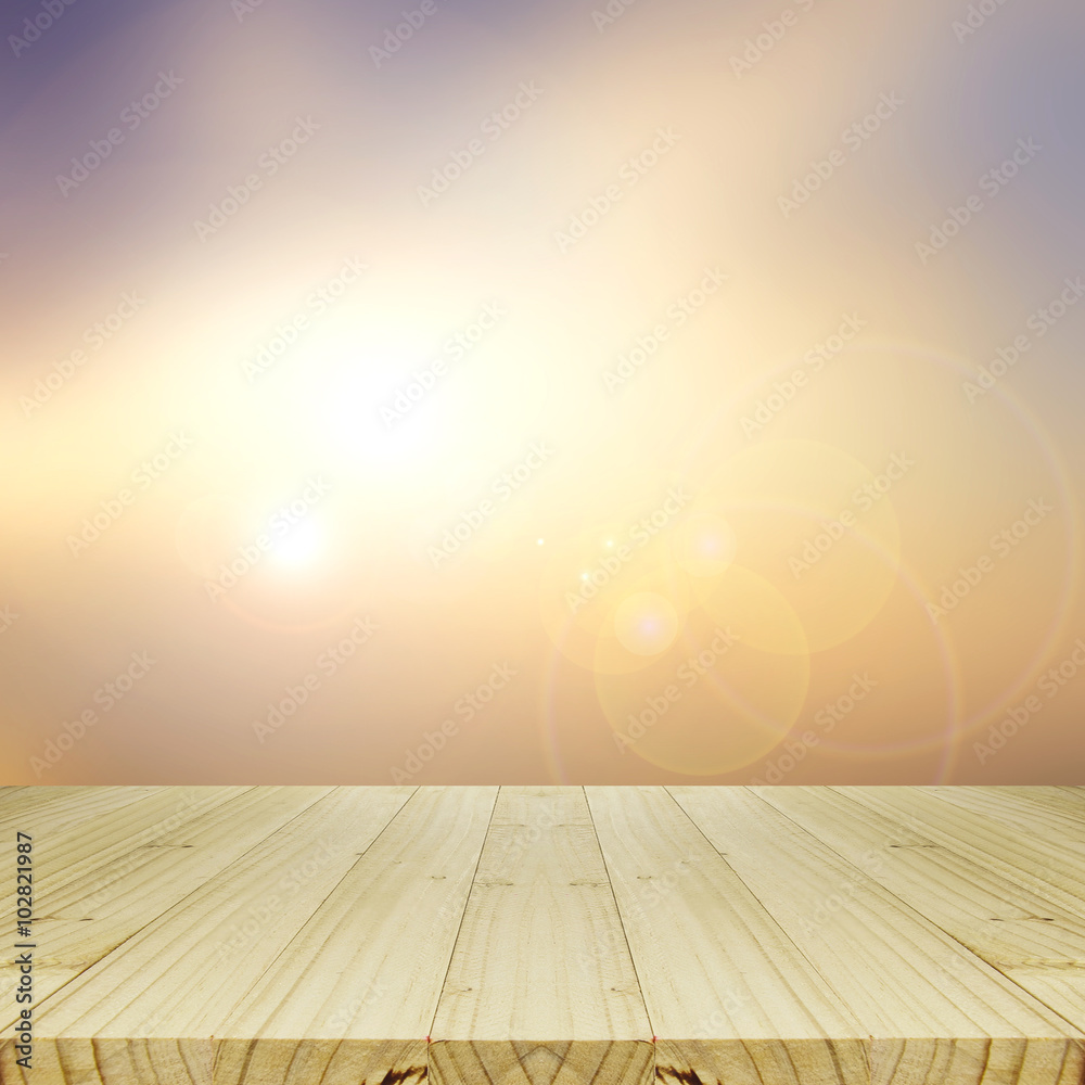 Wood Table and Blurred Sunrise Background. Wood Table and Blurred Sunrise Background.