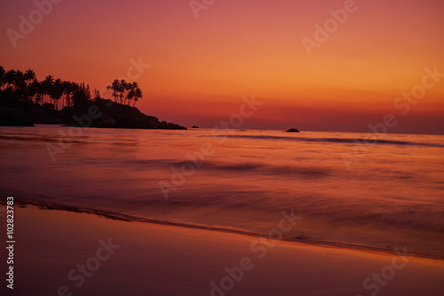 Calm peaceful ocean and beach on tropical sunrise. Bali  Indones