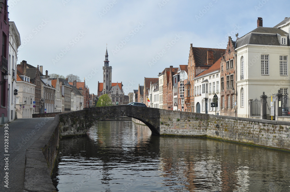 Obraz premium A panorama of picturesque Bruges in Belgium with the Zwin river a bridge and an old distinctive church in the background