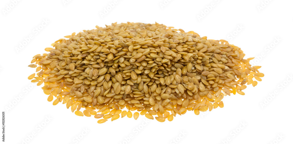 Portion of organic golden flaxseed on a white background Portion of organic golden flaxseed on a white background