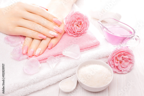 french manicure with essential oils  rose flowers. spa