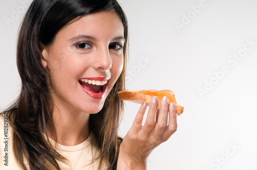 Woman eating a toast