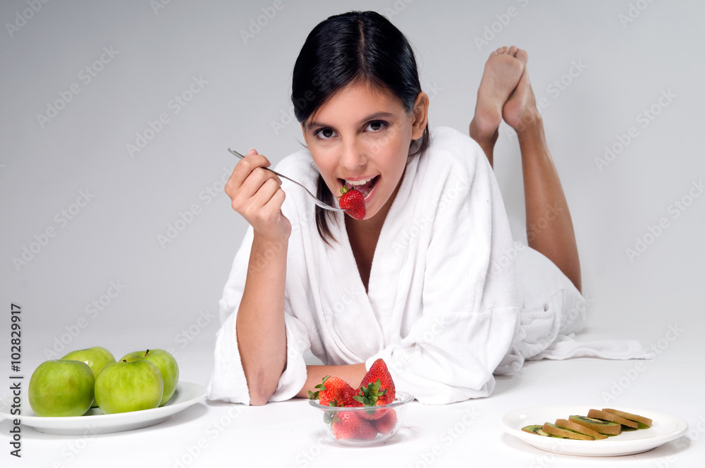 Woman eating some fruit