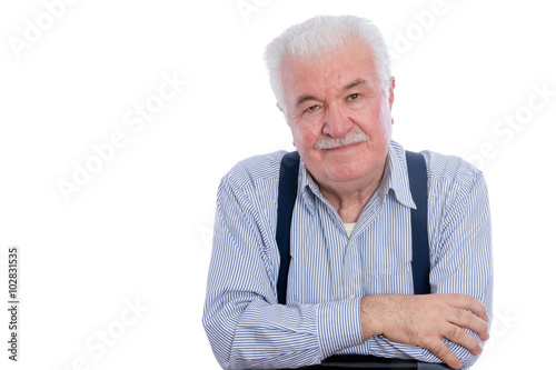 Man in striped shirt and folded arms