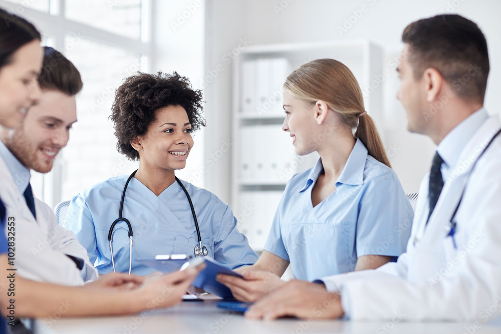 group of happy doctors meeting at hospital office group of happy doctors meeting at hospital office