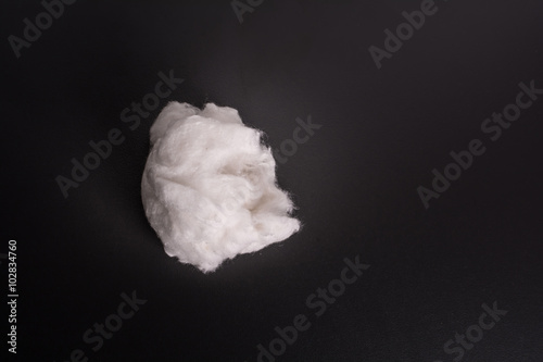 Cotton white ball against a dark background