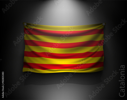 waving flag catalonia on a dark wall 
