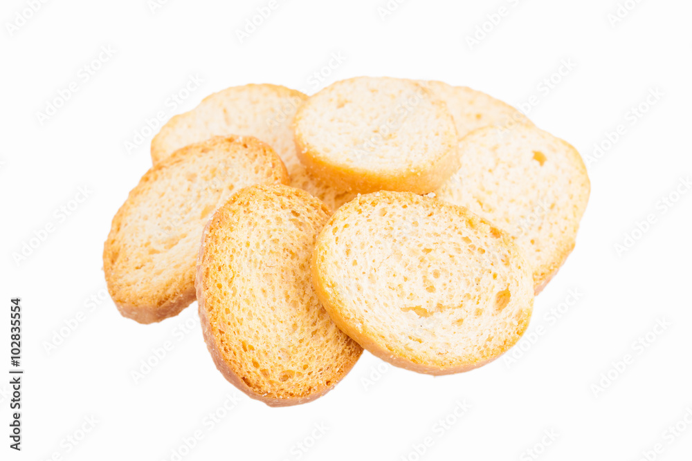 White bread croutons with salt on a white background