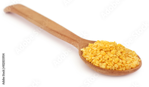 Mung dal in wooden spoon
